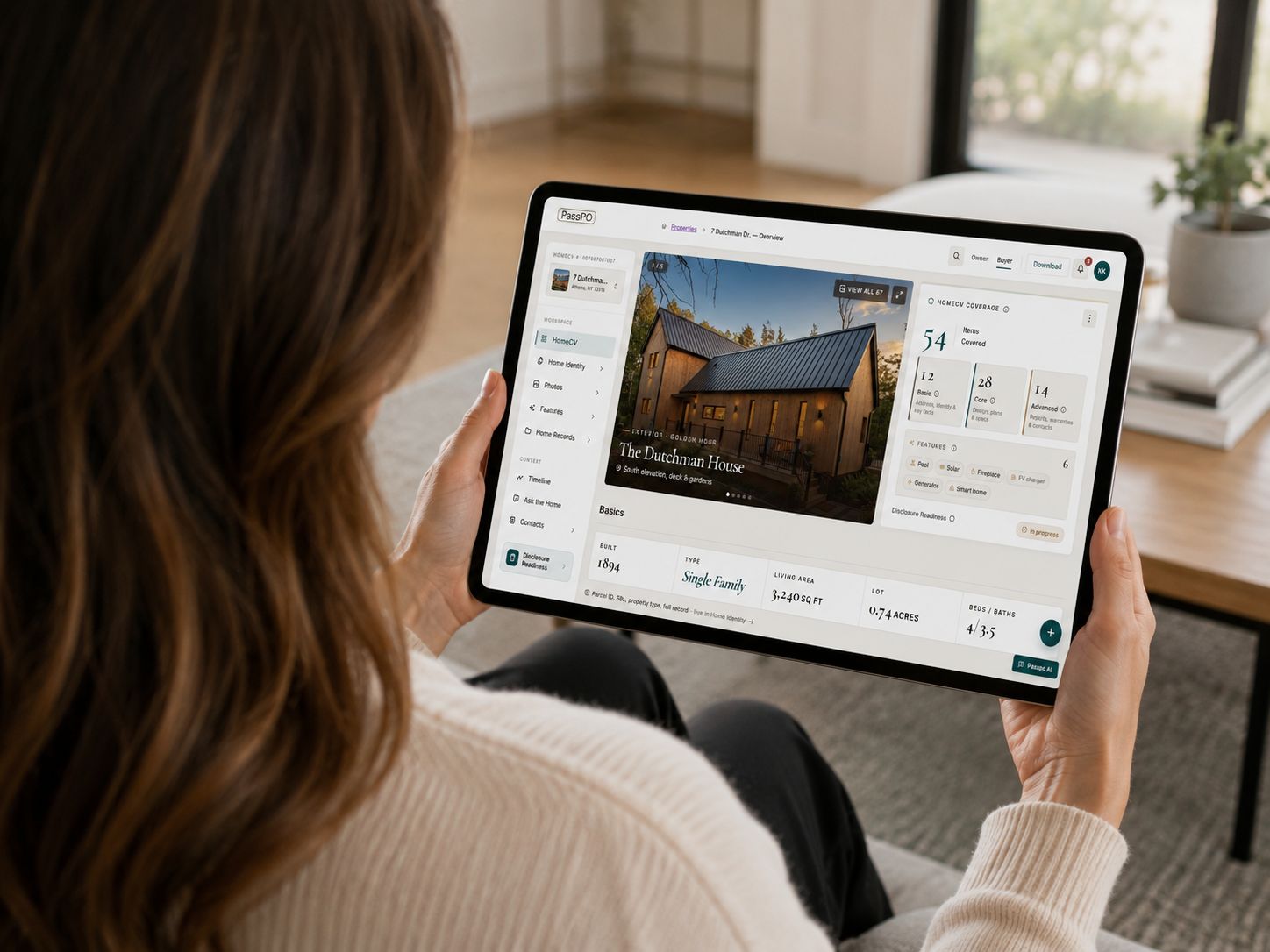 A homeowner viewing their HomeCV dashboard for The Dutchman House on a tablet